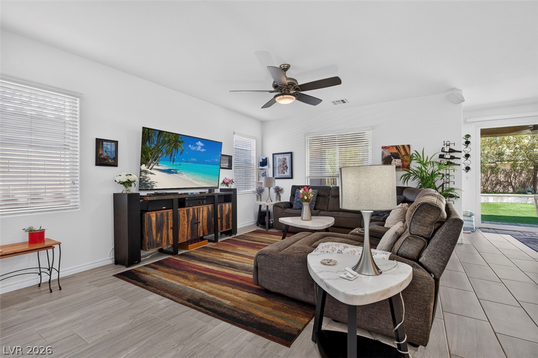 1824 Redland Ridge Street Henderson, NV 89002 - Photo 7 of 69 Relaxed living space featuring easy-care flooring and direct outdoor access.