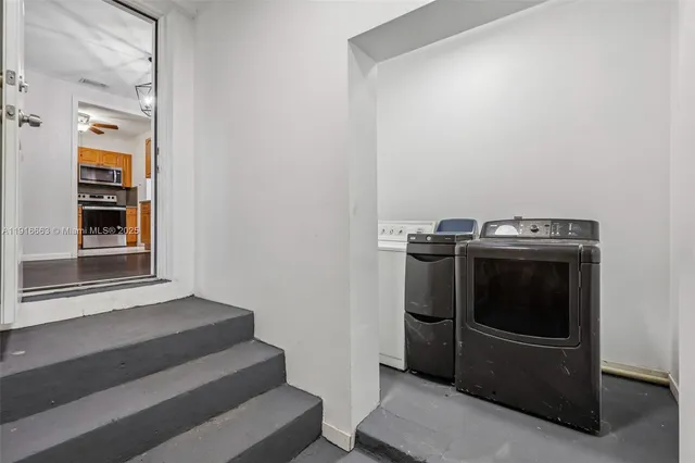 a utility room with washer and dryer