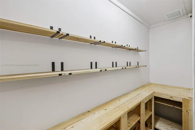 a view of a room with racks on the wall