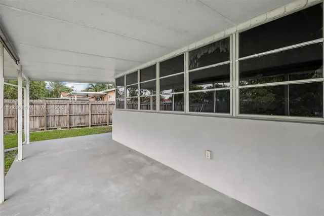 a view of house with a big yard