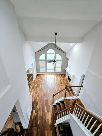 a view of an entryway with wooden floor