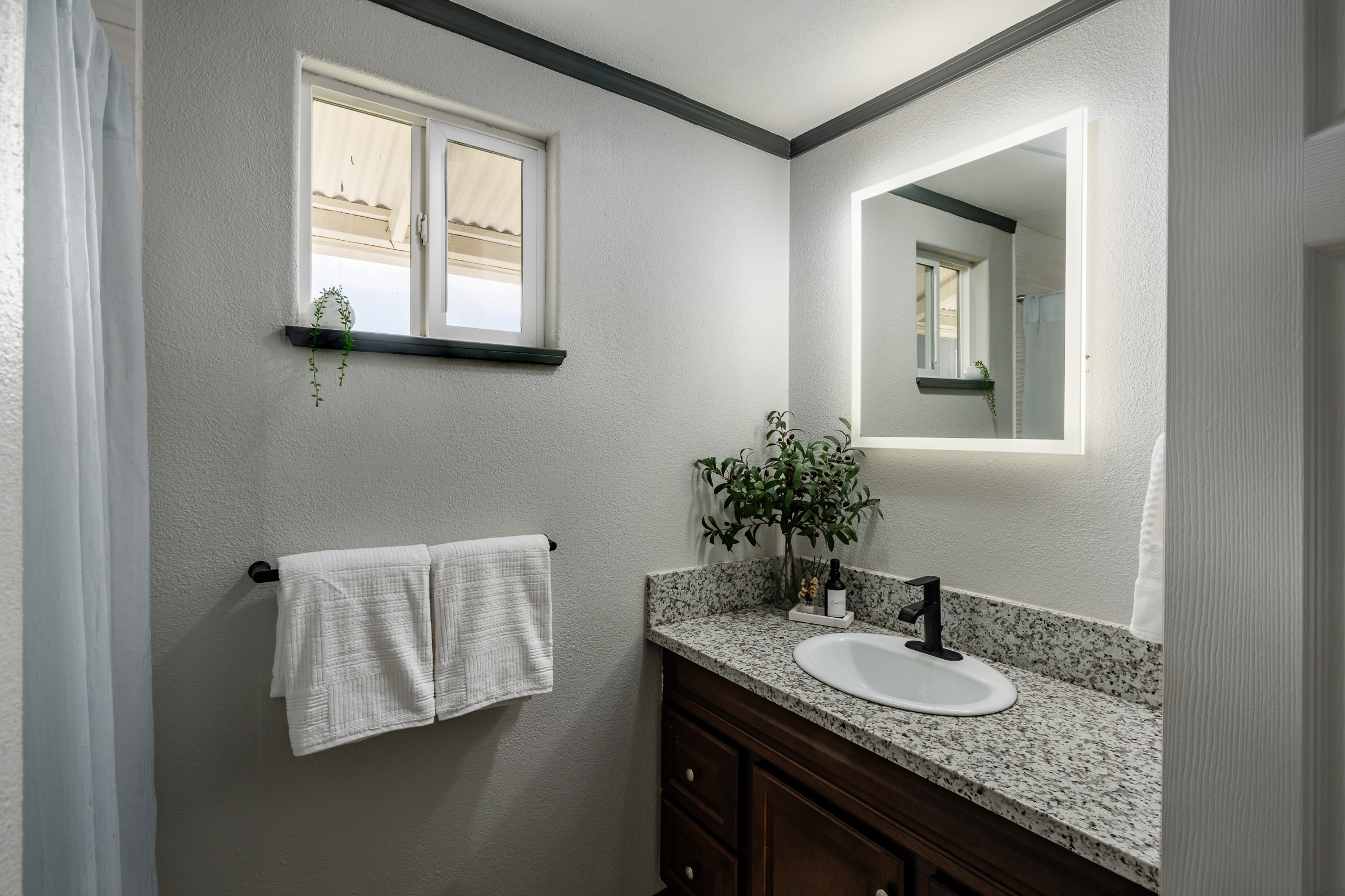 64-5246 Puu Nani Drive Kamuela, HI 96743 - Photo 14 of 25 a bathroom with a granite countertop sink and a mirror
