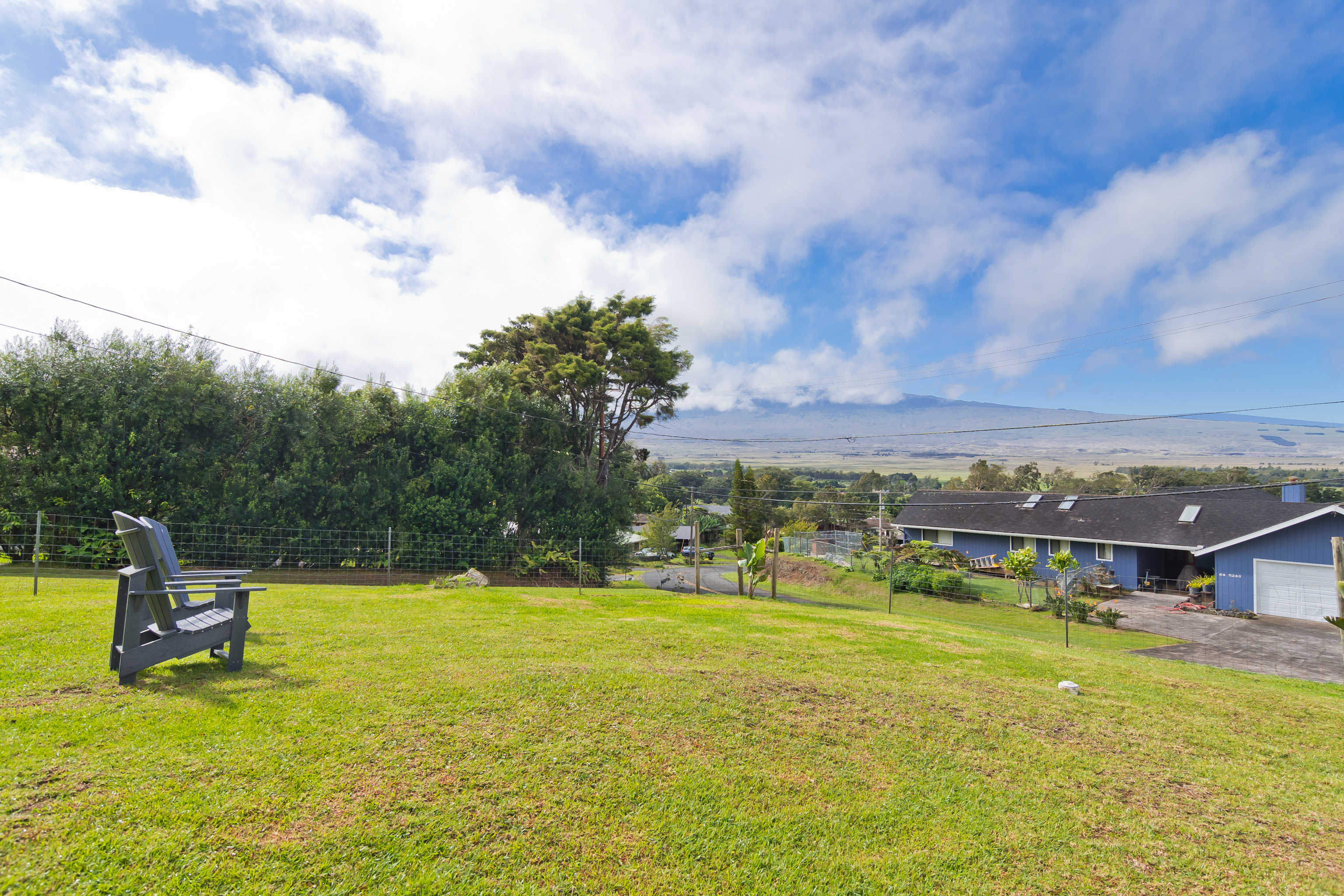 64-5246 Puu Nani Drive Kamuela, HI 96743 - Photo 2 of 25 a view of a swimming pool with a yard and a large tree