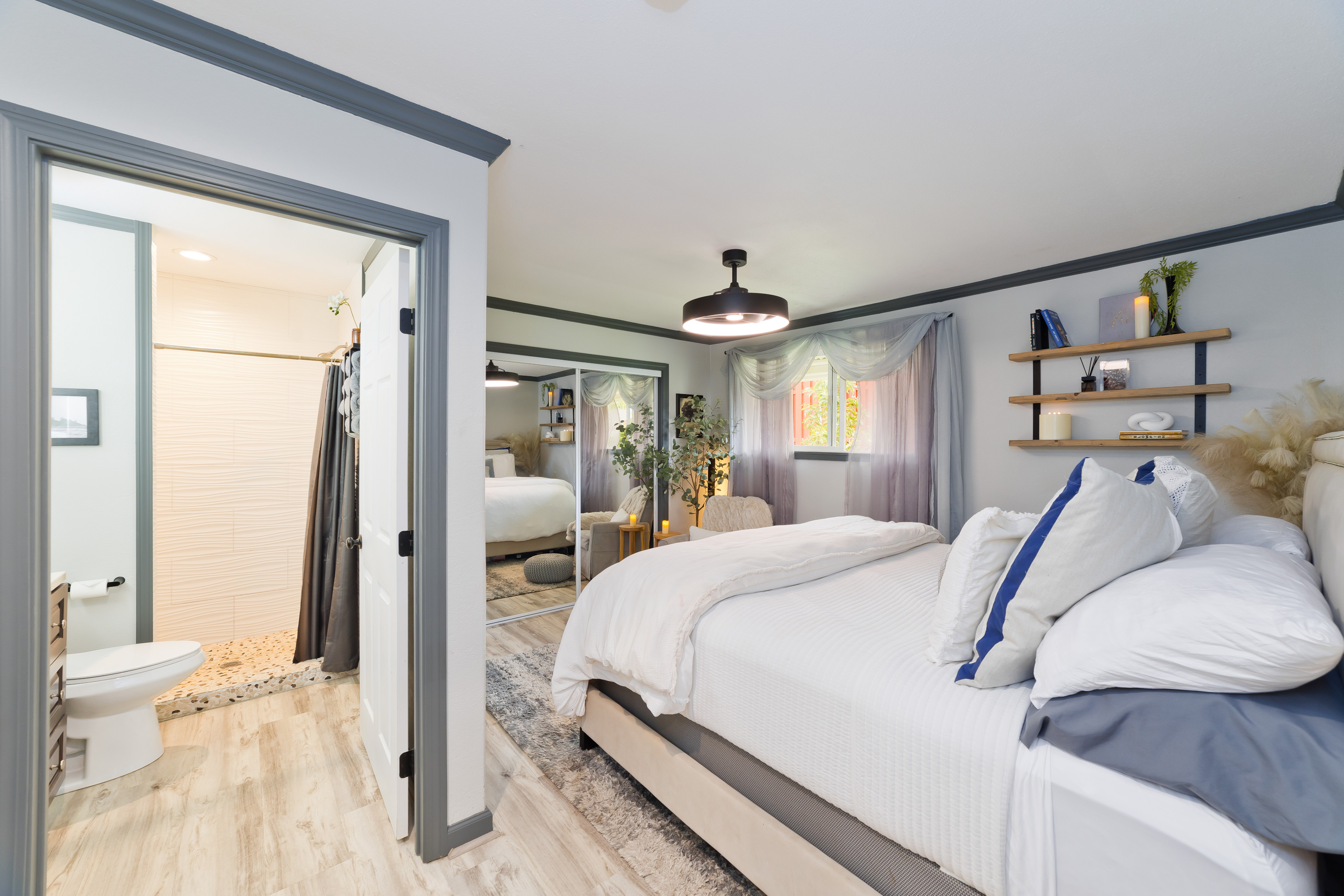 64-5246 Puu Nani Drive Kamuela, HI 96743 - Photo 7 of 25 a bedroom with a large bed and a chandelier