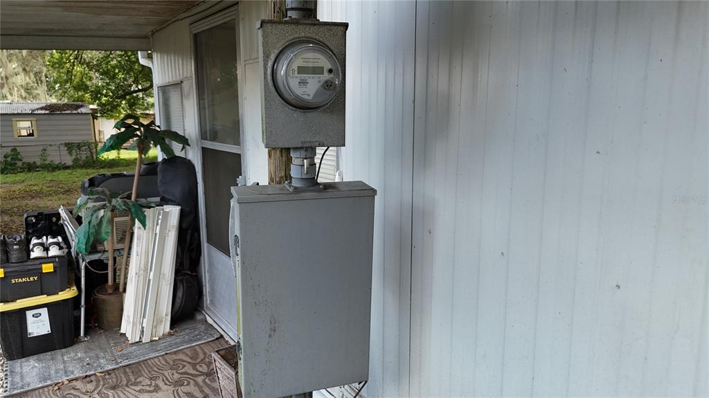 16935 Southeast 101st Avenue Road Summerfield, FL 34491 - Photo 11 of 17 a view of a hallway with washer and dryer