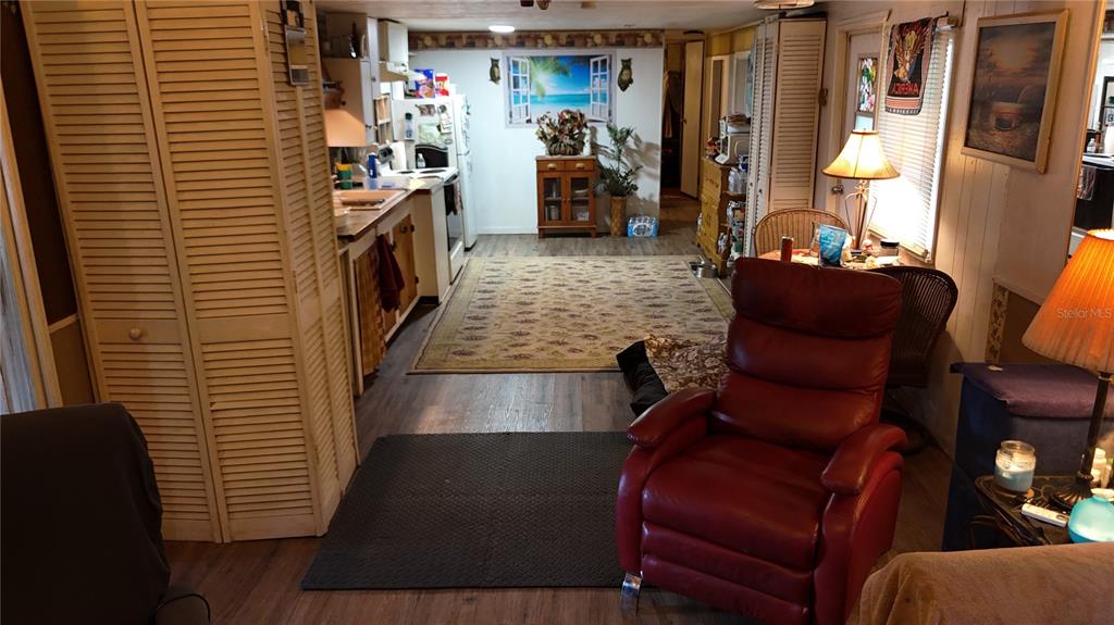 16935 Southeast 101st Avenue Road Summerfield, FL 34491 - Photo 3 of 17 a living room with furniture and a window