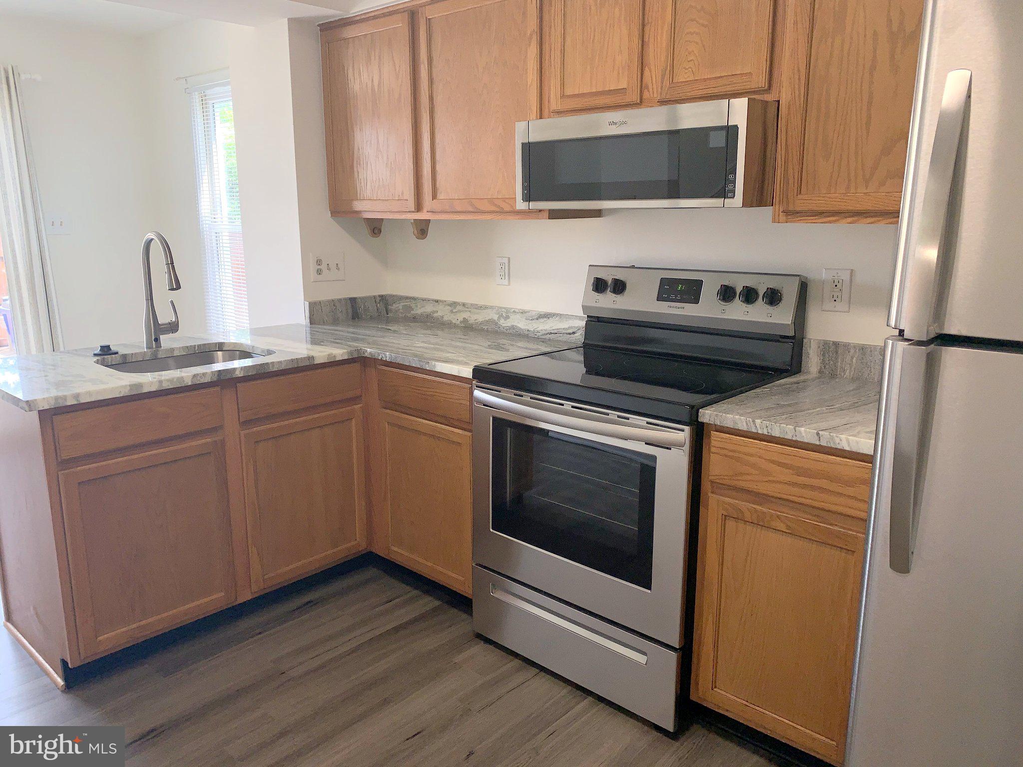126 Ice Street Frederick, MD 21701 - Photo 3 of 13 Modern kitchen with sleek finishes.