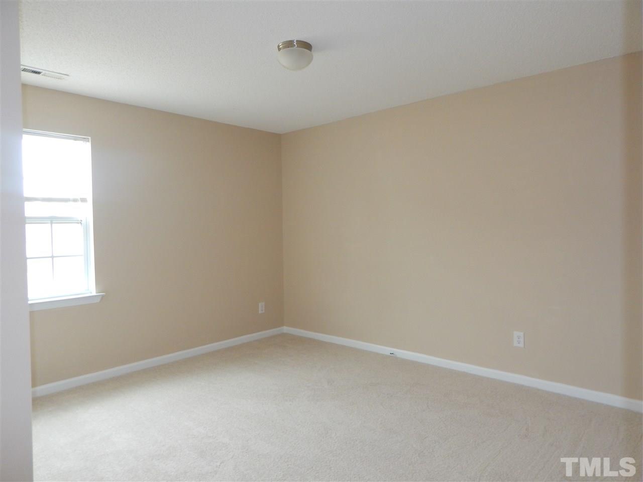 4808 Cutstone Court Raleigh, NC 27610 - Photo 12 of 14 an empty room with a window