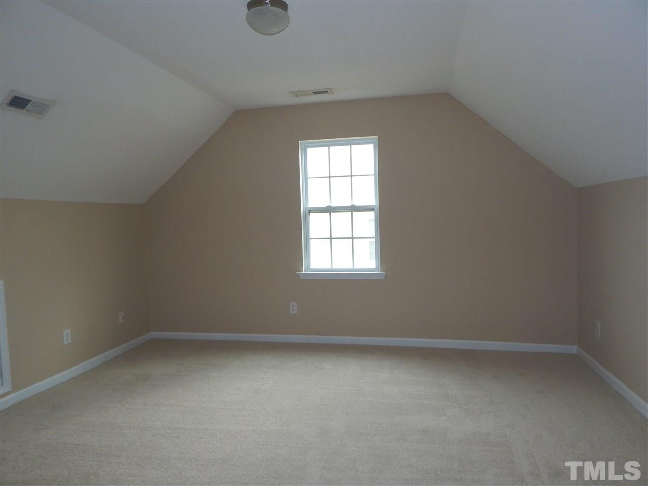 4808 Cutstone Court Raleigh, NC 27610 - Photo 13 of 14 an empty room with a window