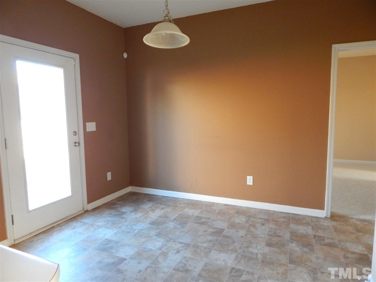 4808 Cutstone Court Raleigh, NC 27610 - Photo 6 of 14 a view of an empty room with a window