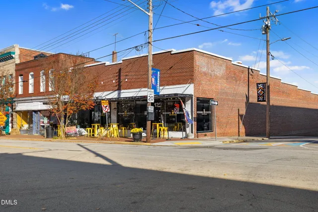 a view of a street with a building in the background