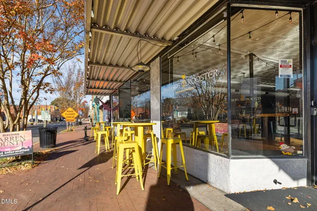a view of a brick building with large windows