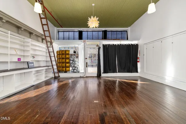 a kitchen with a table and chairs