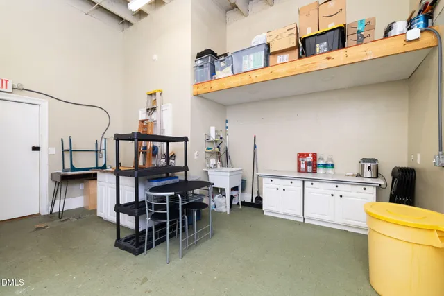 a white toilet sitting next to a bathroom sink and vanity