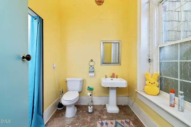 a kitchen with stainless steel appliances granite countertop a refrigerator a stove and a sink with wooden floor