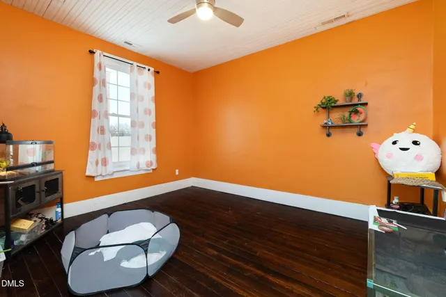 a street view with wooden fence and a bench