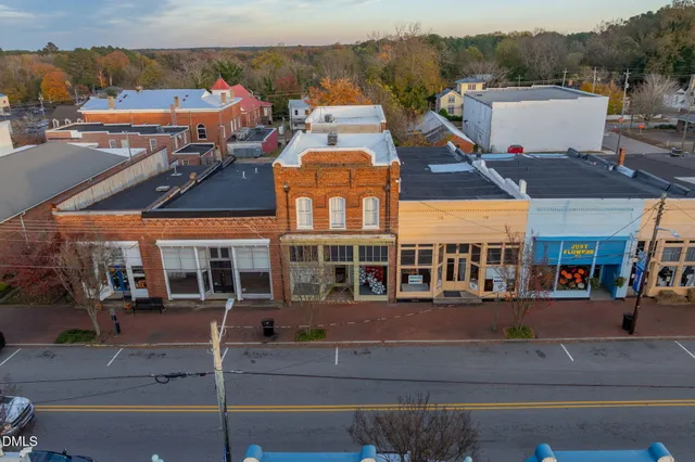a picture of a bench in front of a house