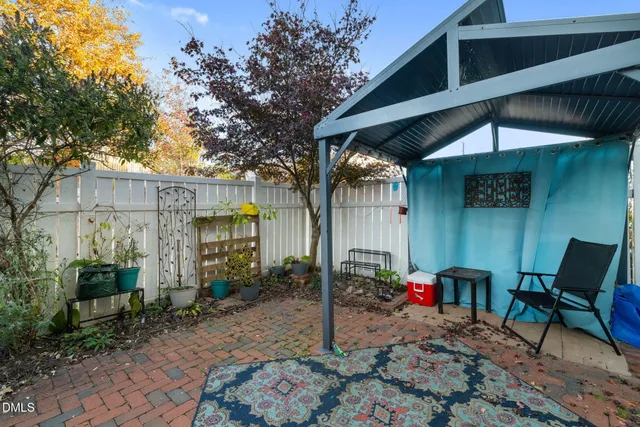 a picture of a bench in front of a house
