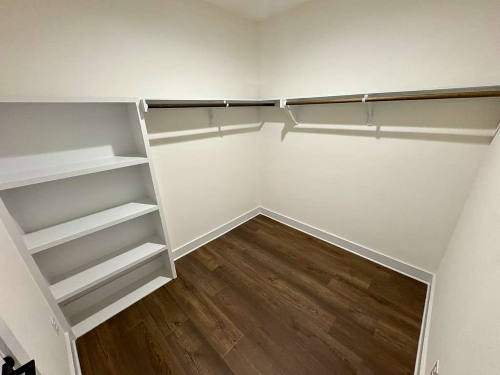 10209 Gail Road Austin, TX 78748 - Photo 25 of 38 Walk in closet featuring dark wood-type flooring