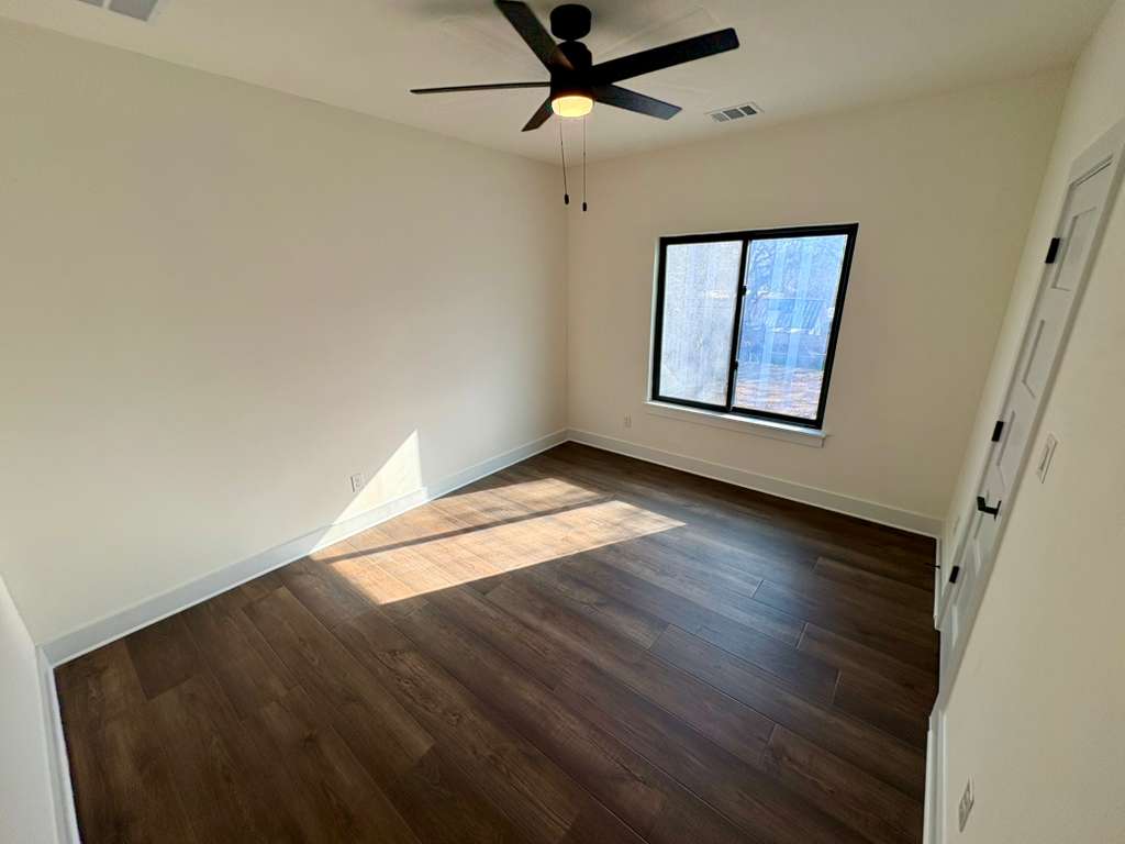 10209 Gail Road Austin, TX 78748 - Photo 31 of 38 Unfurnished bedroom featuring dark wood-type flooring and ceiling fan