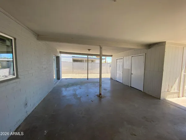 a view of an empty room with a window