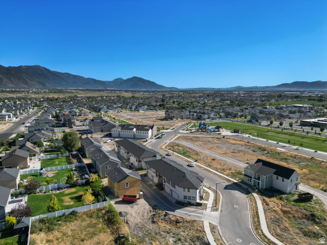 717 South Harrison Drive West Springville, UT 84663 - Photo 30 of 31 Expansive aerial encompassing a developing residential community with distant mountain ranges