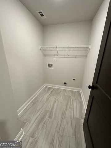 a view of a room with racks on the wall