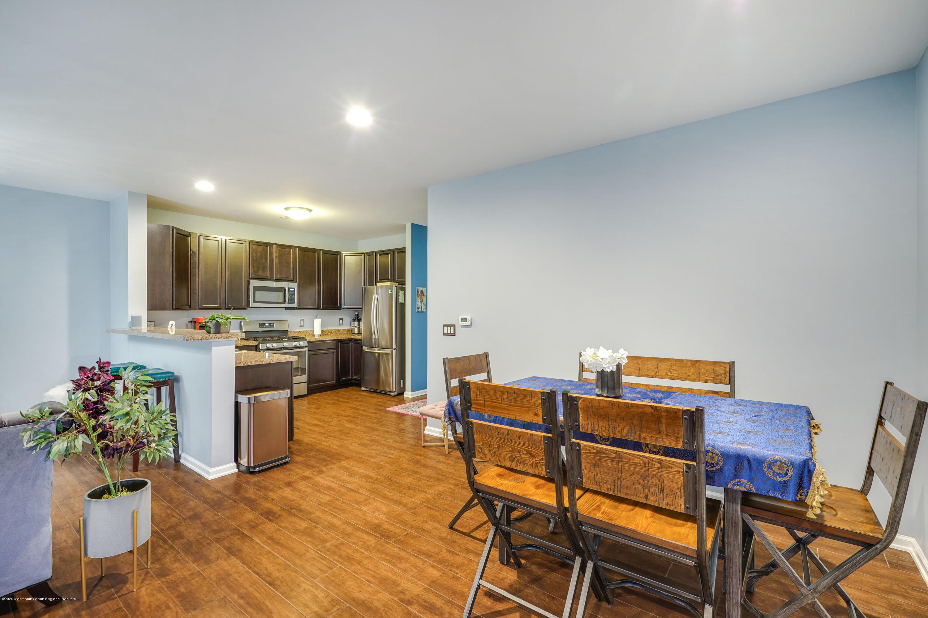 37 Rockingham Way Manchester Township, NJ 08759 - Photo 16 of 36 a living room with dining room and kitchen view