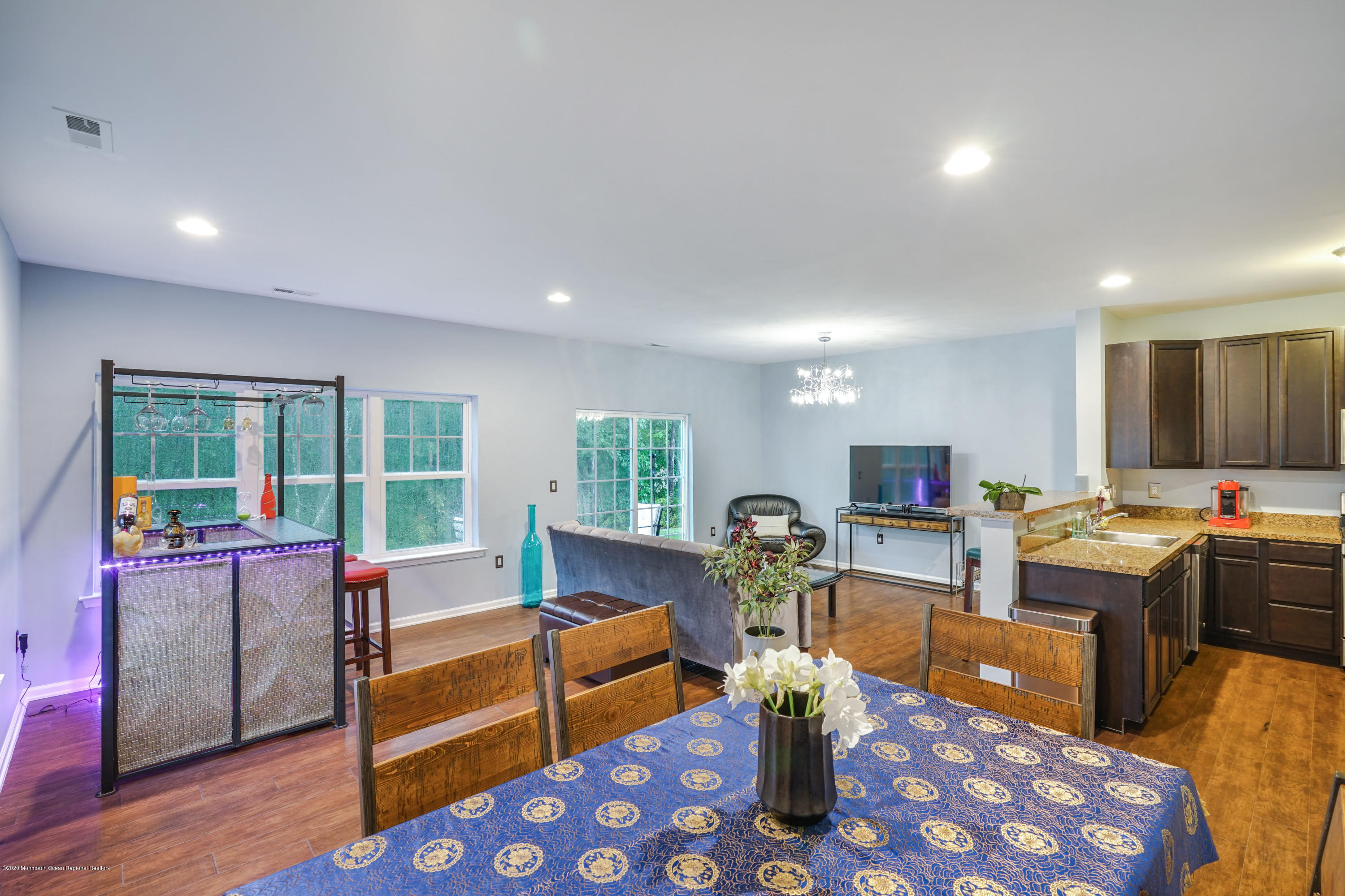 37 Rockingham Way Manchester Township, NJ 08759 - Photo 17 of 36 a living room with furniture fireplace and a table