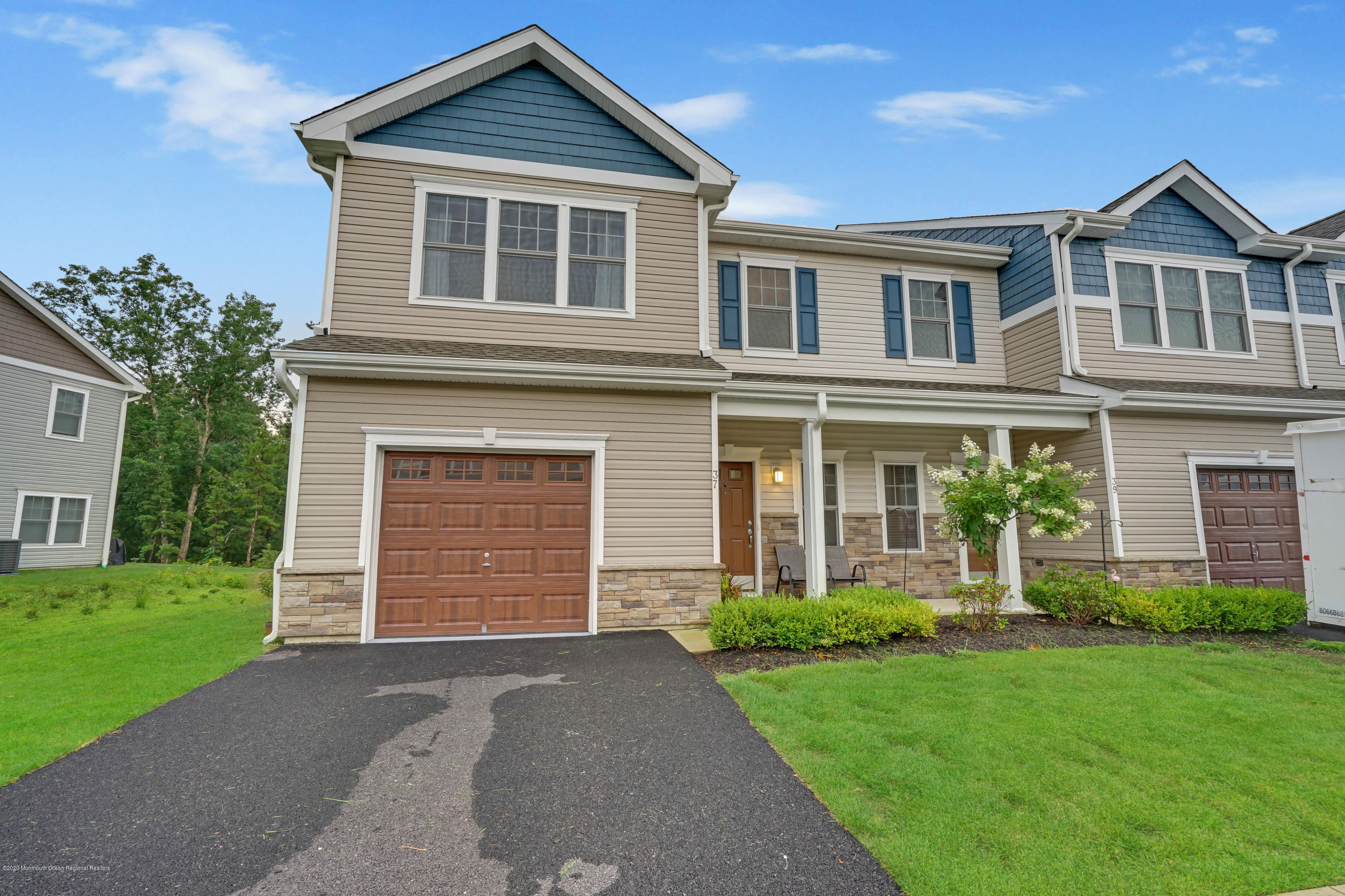 37 Rockingham Way Manchester Township, NJ 08759 - Photo 2 of 36 a front view of a house with a garden