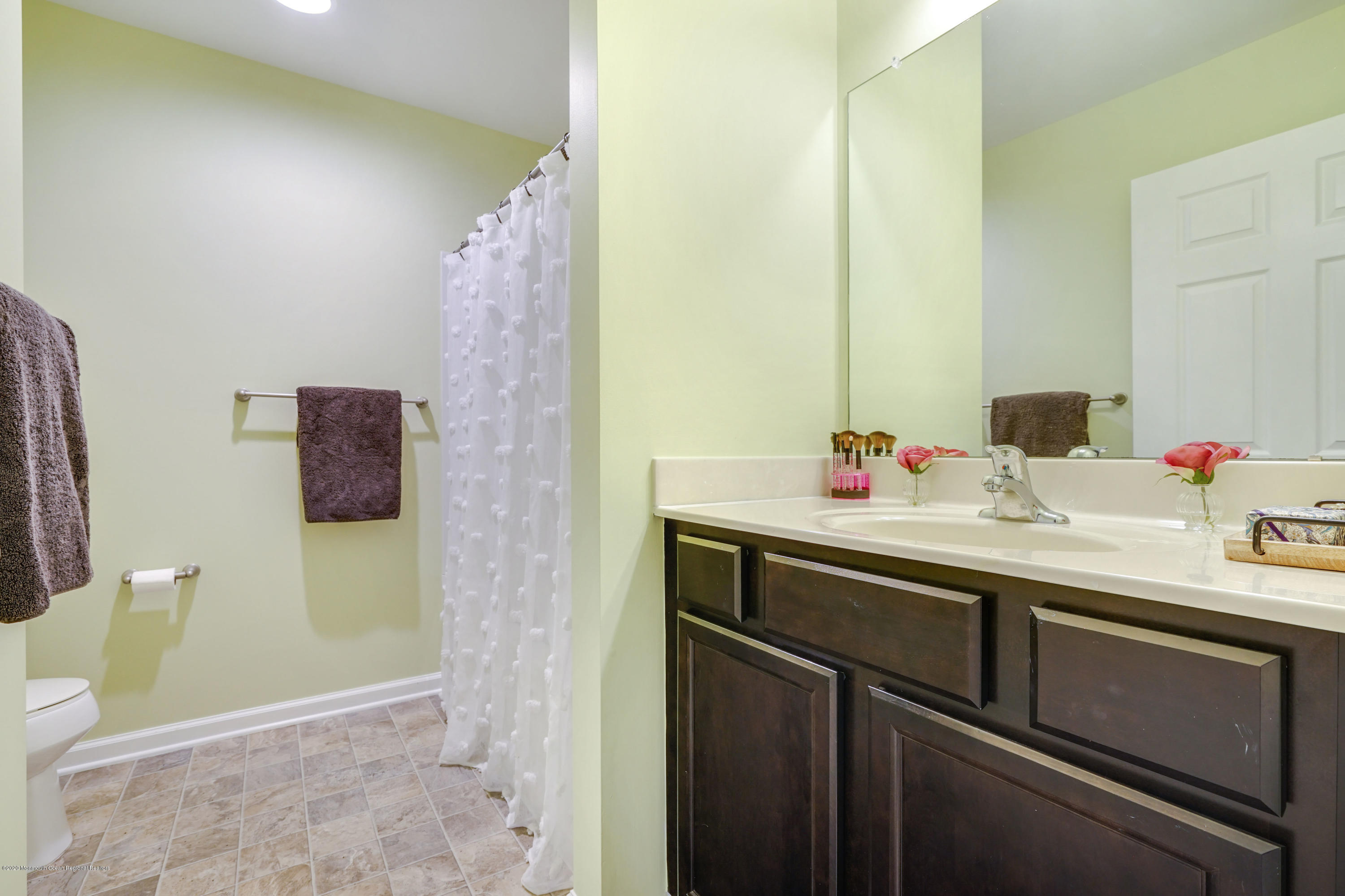 37 Rockingham Way Manchester Township, NJ 08759 - Photo 27 of 36 a bathroom with a sink and a mirror