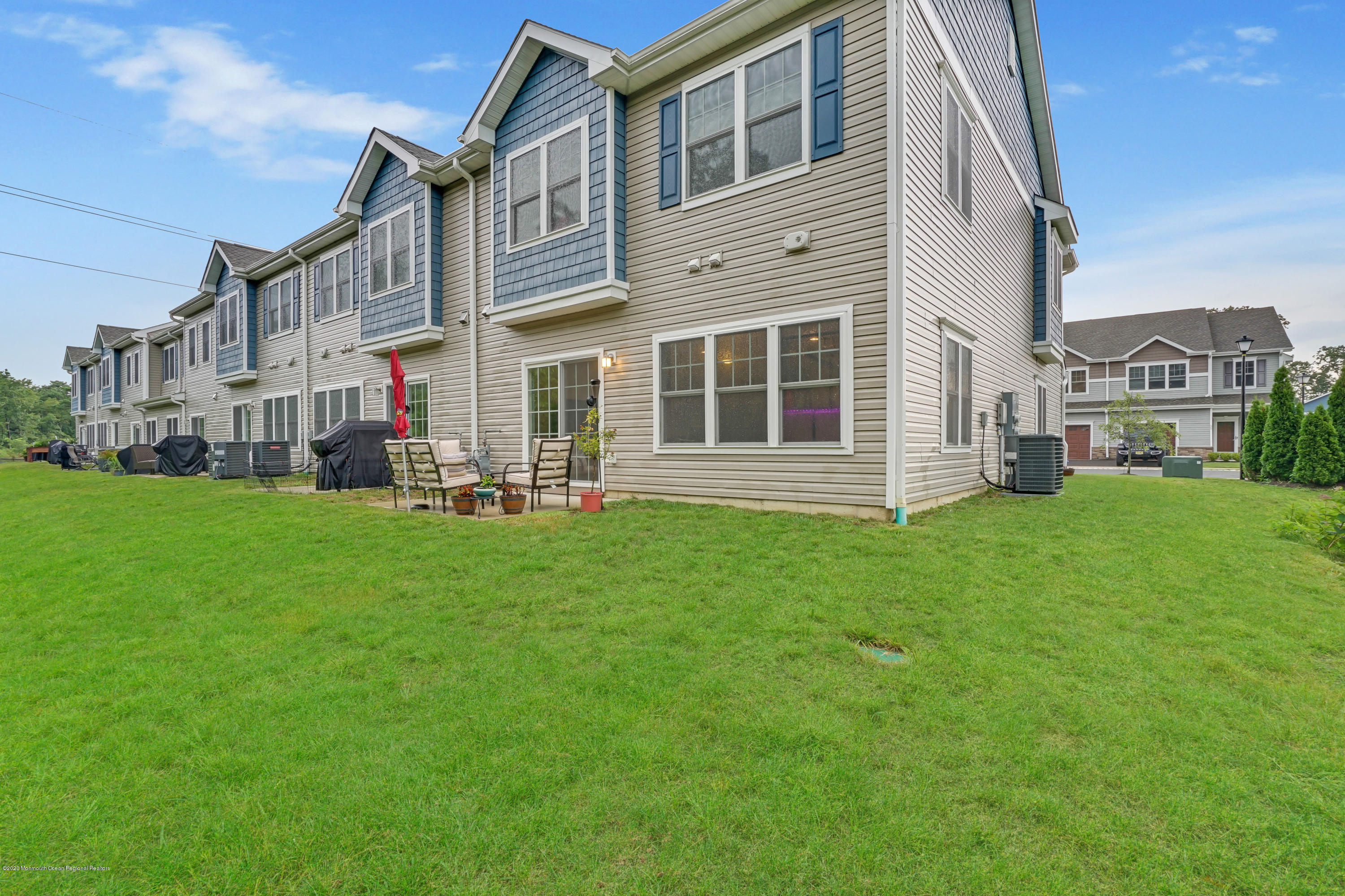 37 Rockingham Way Manchester Township, NJ 08759 - Photo 33 of 36 a view of a house with a yard
