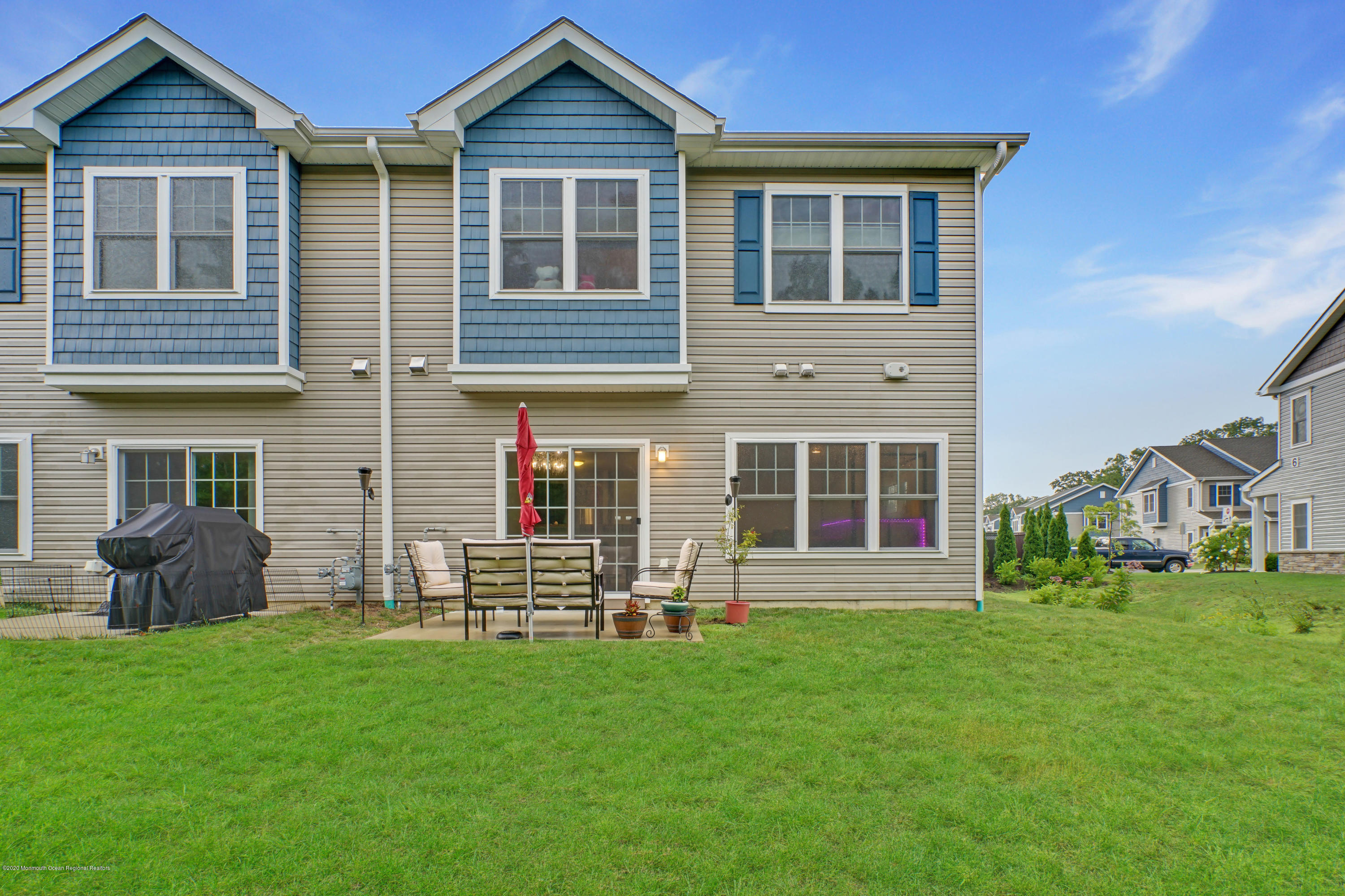 37 Rockingham Way Manchester Township, NJ 08759 - Photo 34 of 36 a front view of a house with a yard