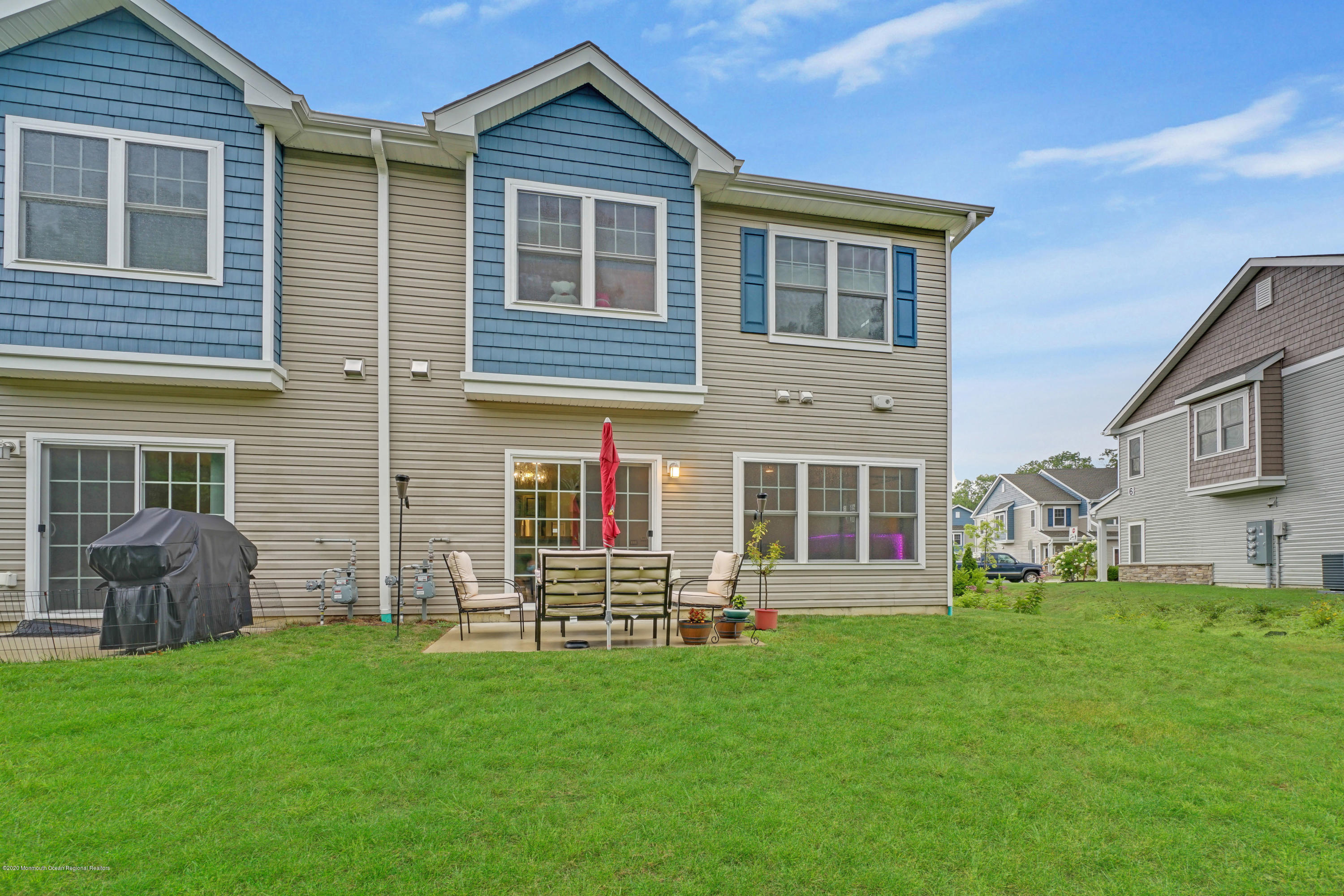 37 Rockingham Way Manchester Township, NJ 08759 - Photo 35 of 36 a front view of a house with garden