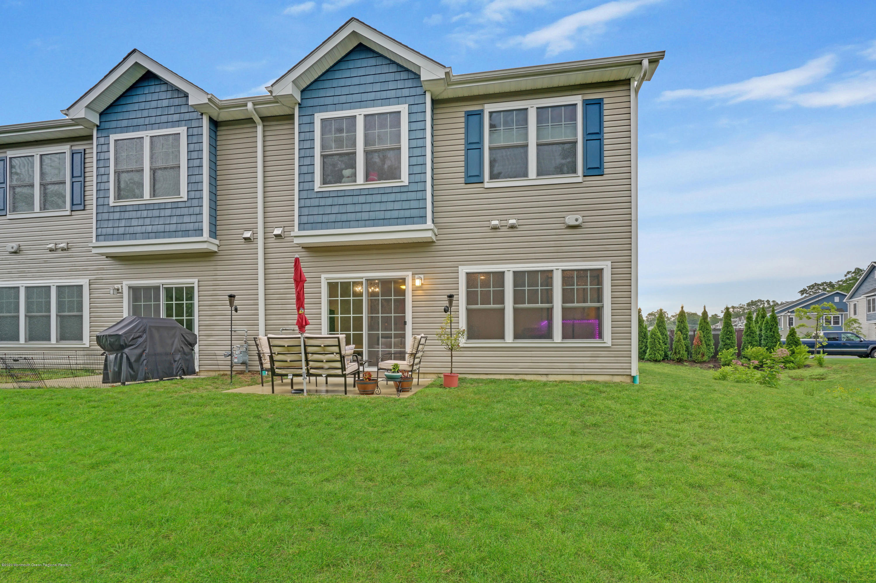 37 Rockingham Way Manchester Township, NJ 08759 - Photo 36 of 36 a front view of a house with a yard