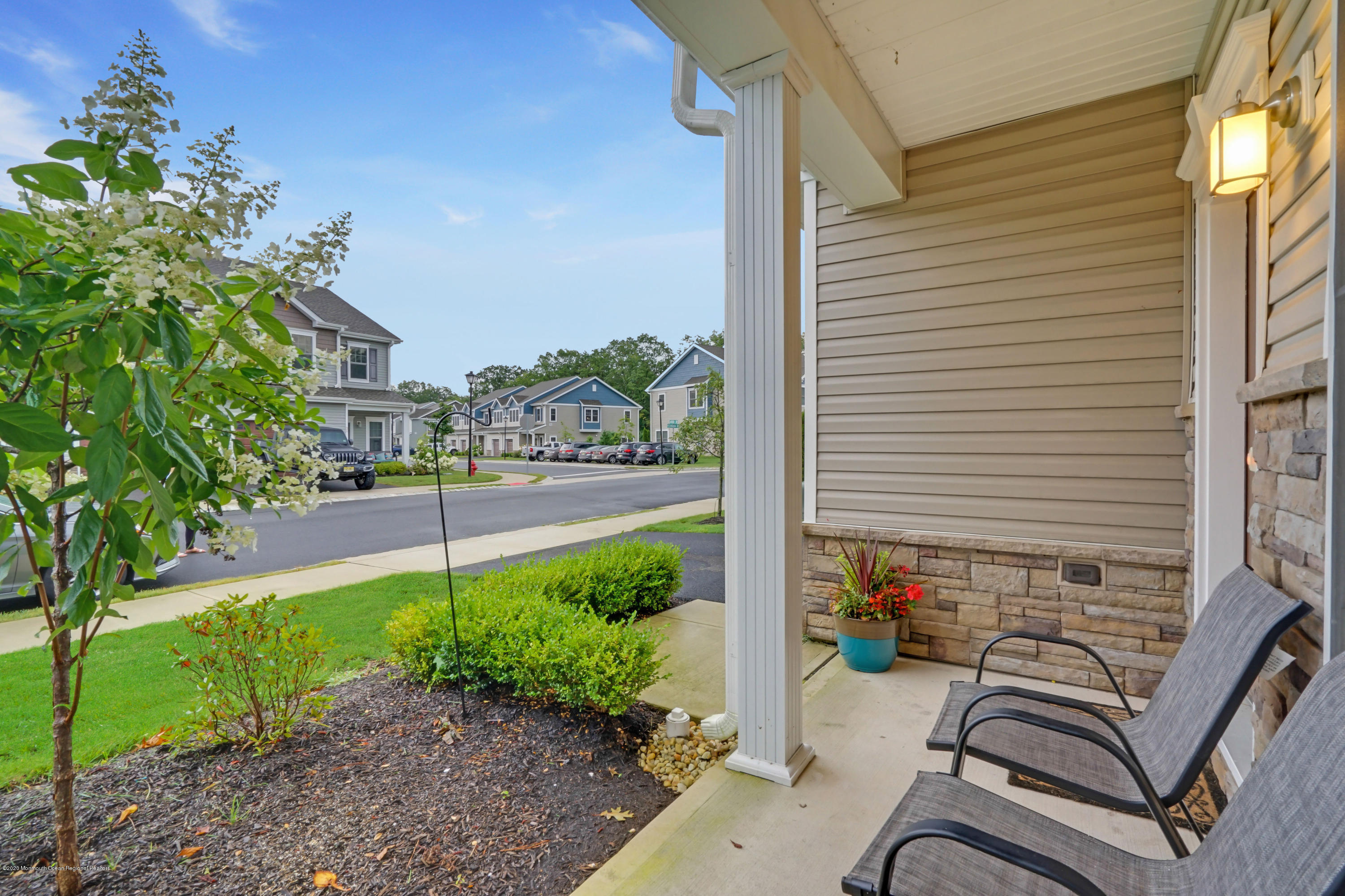 37 Rockingham Way Manchester Township, NJ 08759 - Photo 4 of 36 a view of a chair and tables in the patio