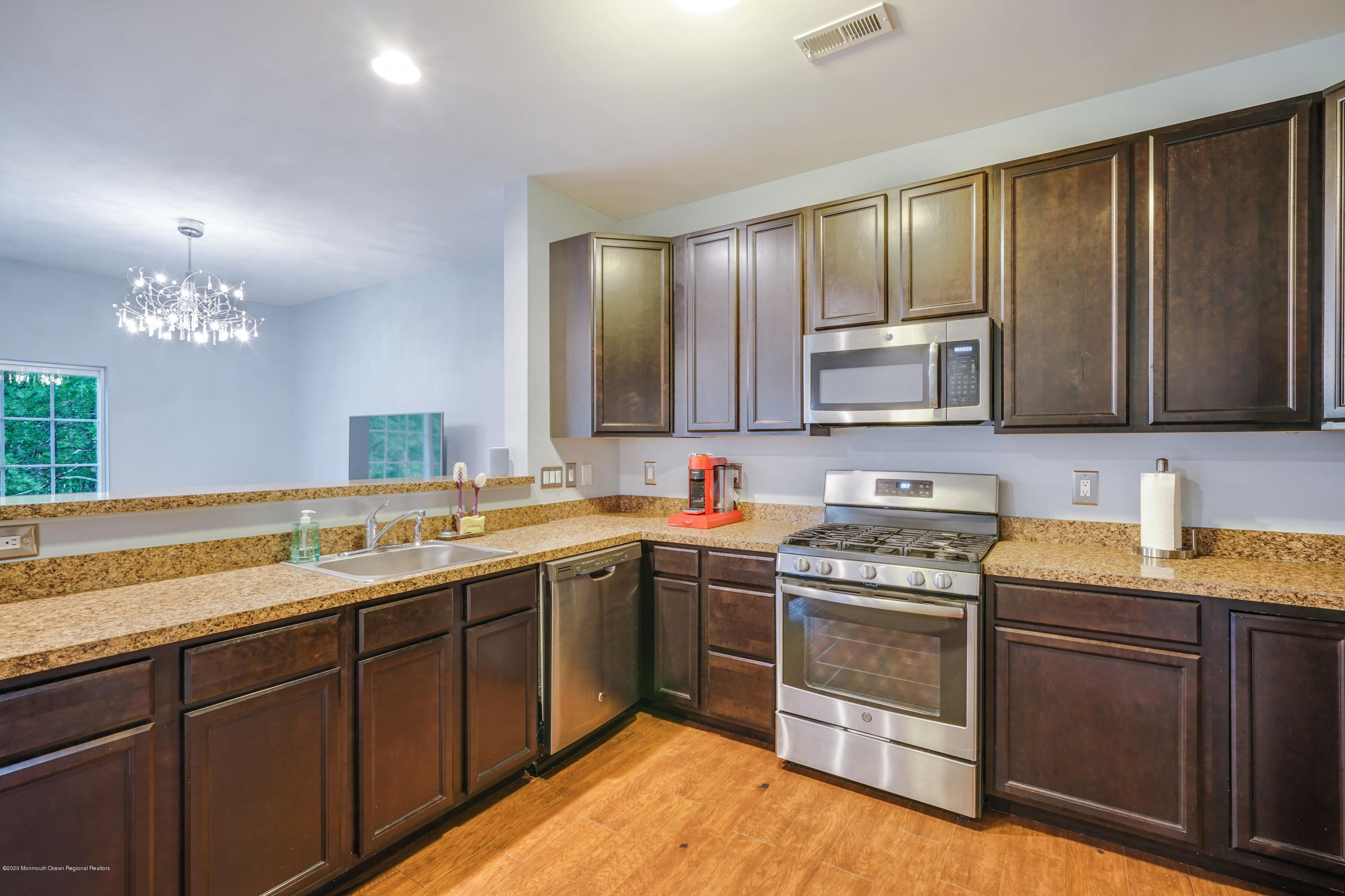 37 Rockingham Way Manchester Township, NJ 08759 - Photo 6 of 36 a kitchen with a sink stove and microwave