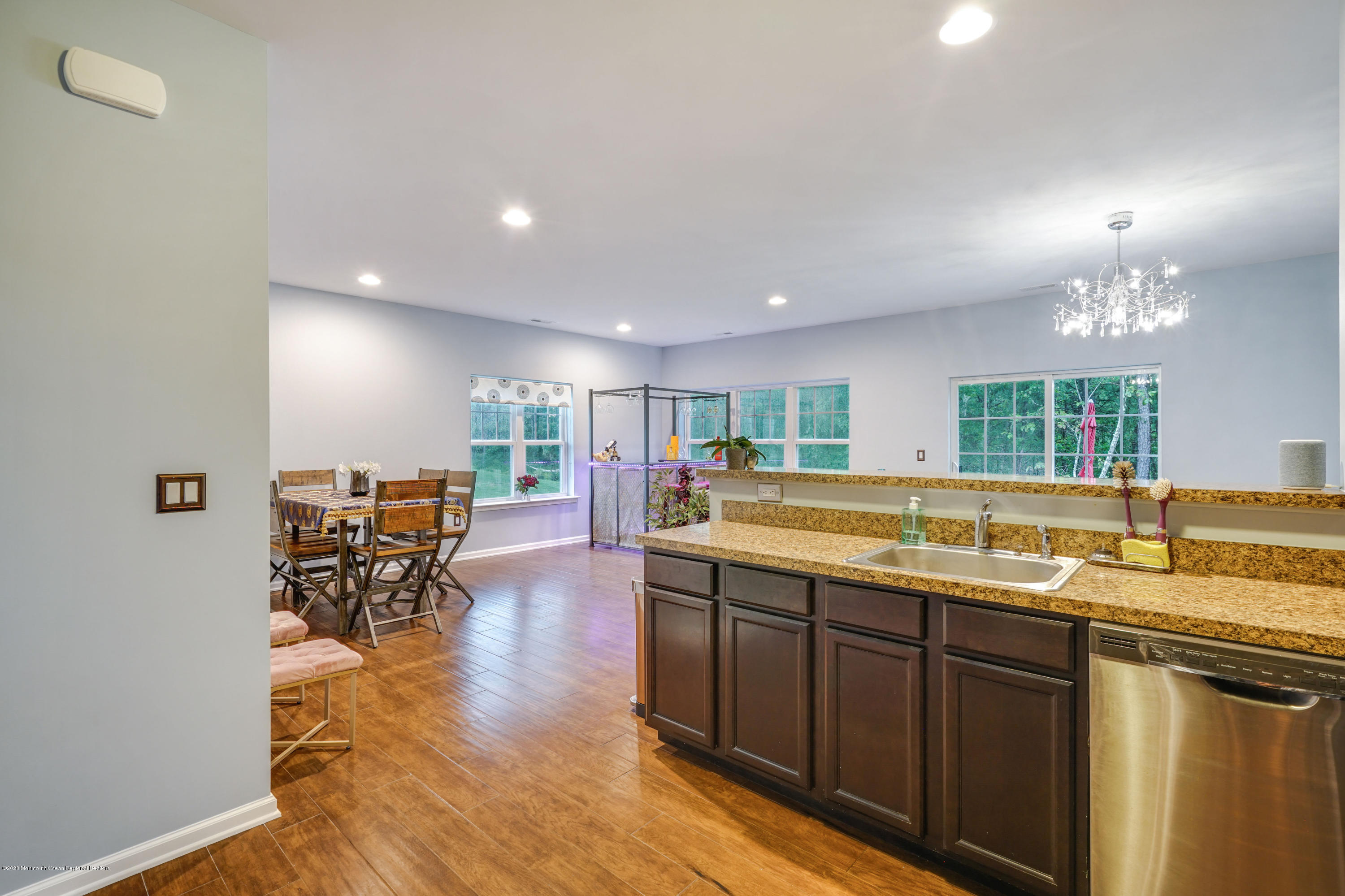 37 Rockingham Way Manchester Township, NJ 08759 - Photo 7 of 36 a kitchen with lots of counter top space and a dining table view