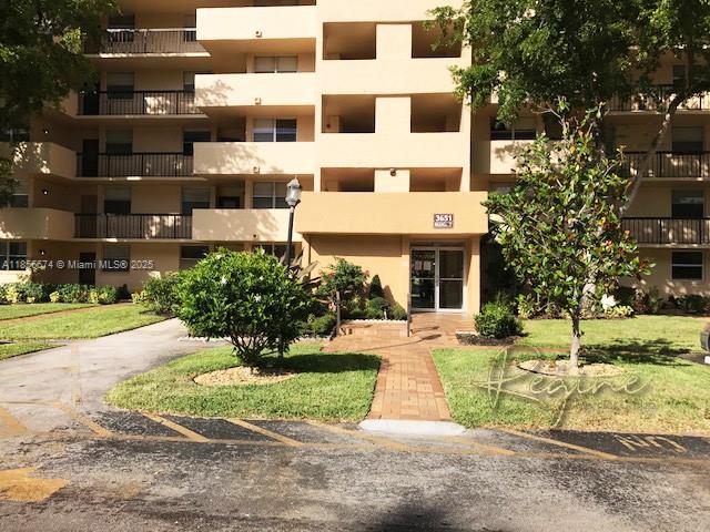 front view of a building with a yard