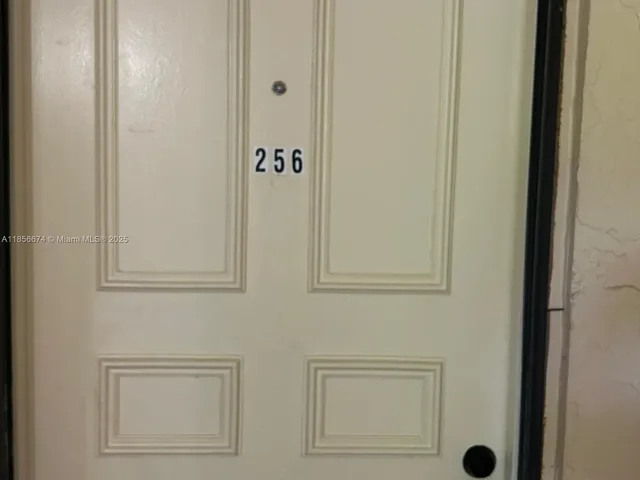 a view with cabinets a sink and dishwasher in a kitchen