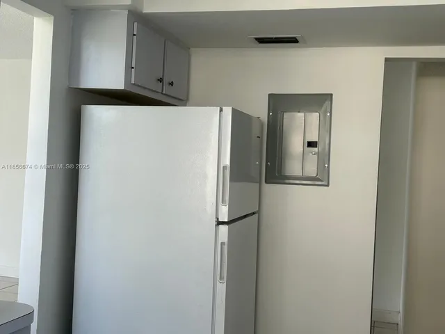 a view of a patio with couches table and chairs and a fire pit