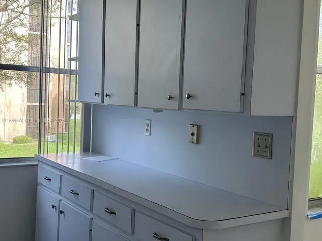 a living room with furniture and a chair