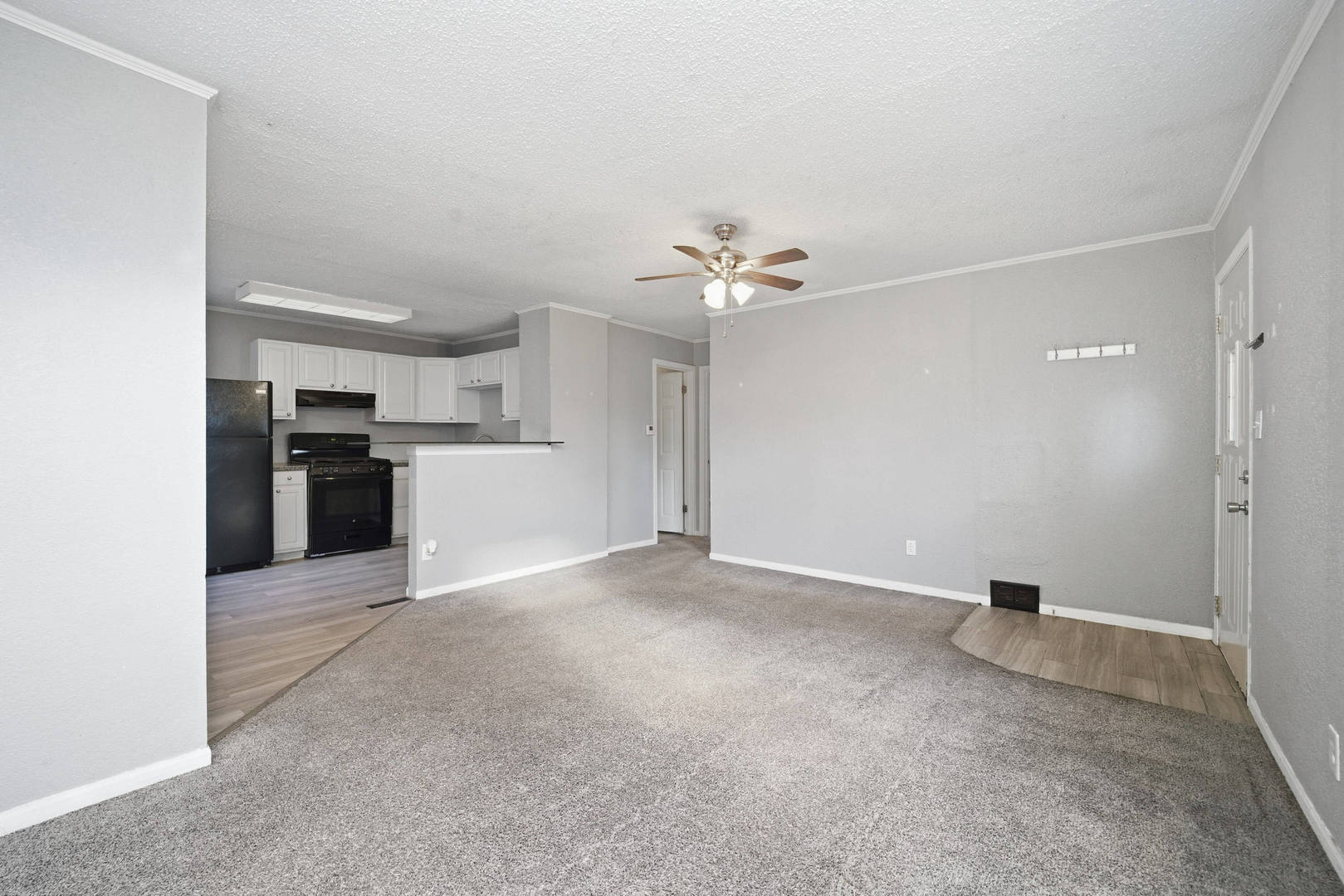 3128 Indian Road Davenport, IA 52802 - Photo 5 of 23 a view of a kitchen with a sink and a refrigerator