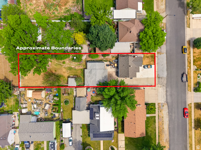 74 South 300 East Springville, UT 84663 - Photo 42 of 48 Aerial perspective showcasing a property with a gray-roofed dwelling, a paved driveway, and an expansive rear yard