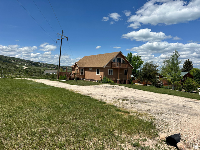 12 Crook Street Fish Haven, ID 83287 - Photo 6 of 35 View of front facade featuring a front lawn