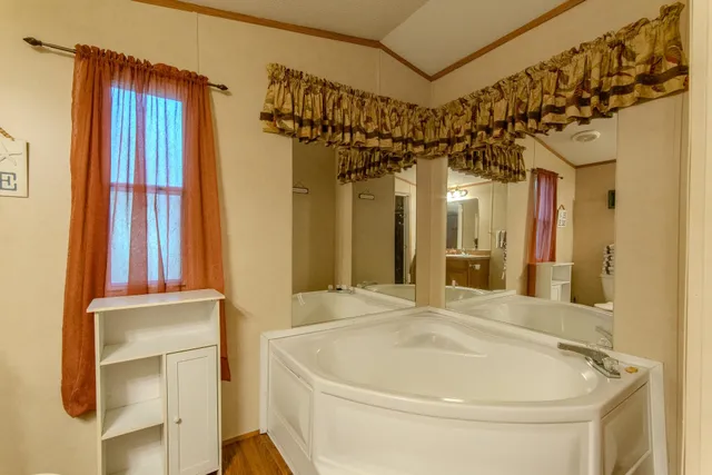 a bathroom with a bathtub and a shower