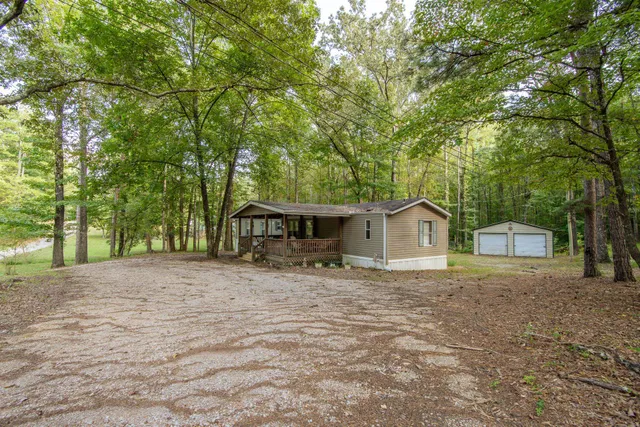 a front view of a house with yard