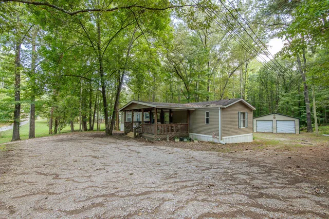 a house with trees in the background