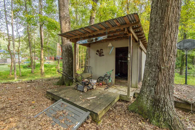 a view of house with a trees around