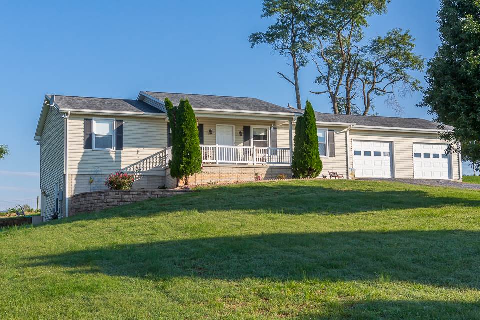 5296 Briery Branch Road Dayton, VA 22821 - Photo 1 of 45 a front view of a house with a garden